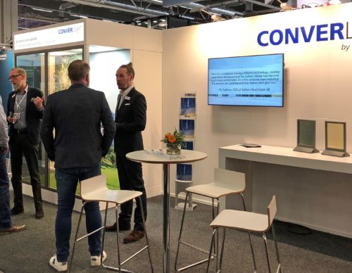 ChromoGenics employees at a exhibition talking about ConverLight