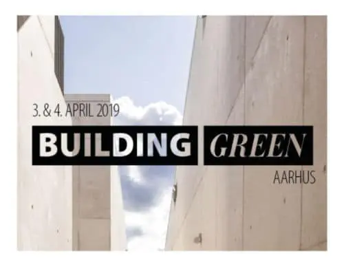 The text "Building Green Aarhus" in a black block over a background of grey buildings