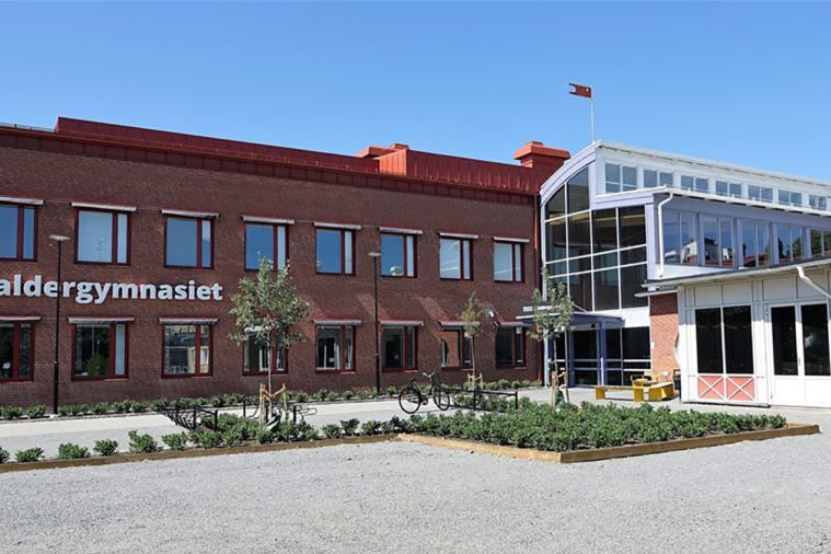 The exterior of Baldergymnasiet in Skellefteå, Sweden on a sunny day.