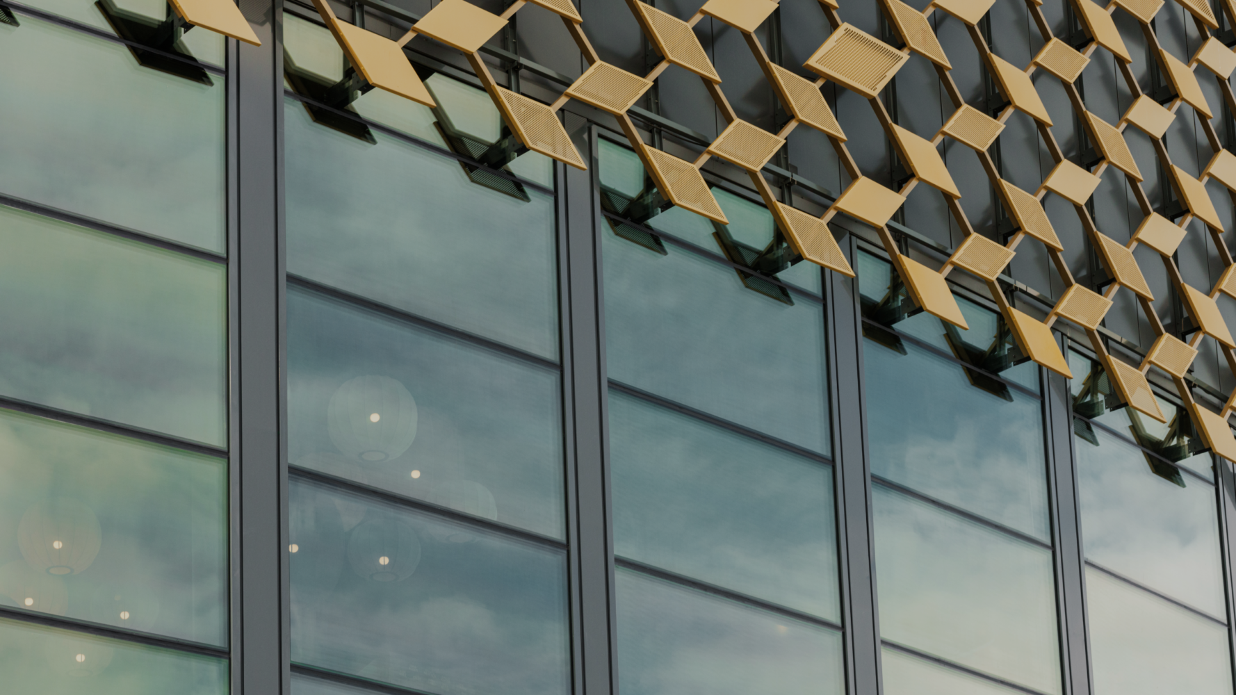 Gold metal on glass faacade close up